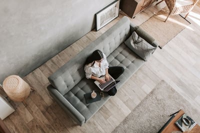 Person working at laptop on couch