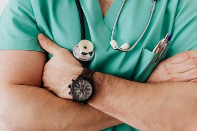 Close up of healthcare worker folding arms