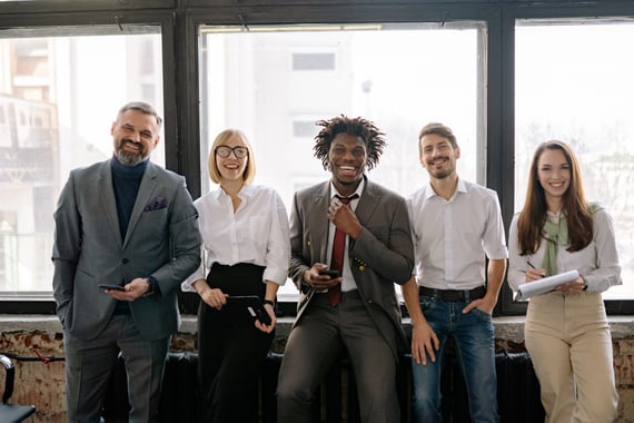 Smiling office workers standing in a row