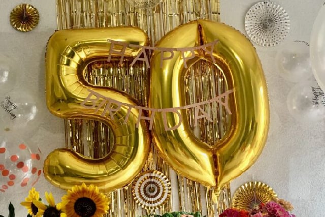 50th birthday balloons in party display