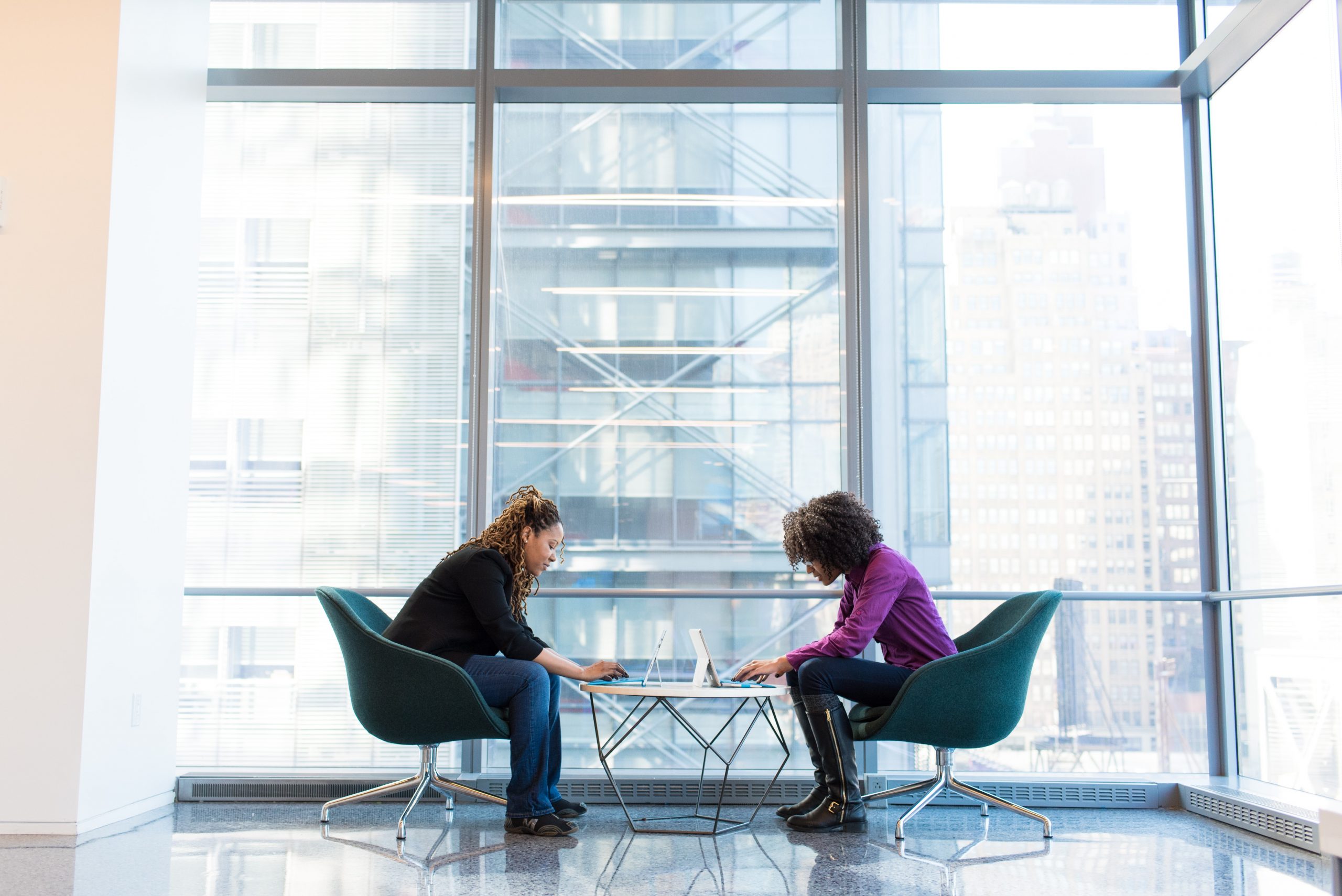 Two people working together on small table