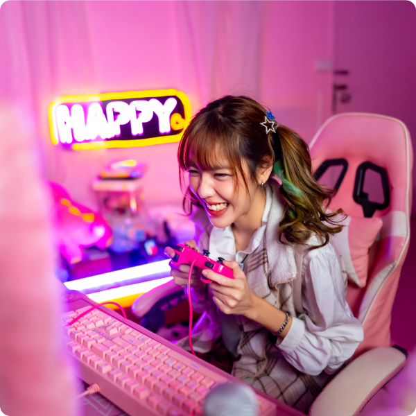 gaming influencer playing with controller in pink room