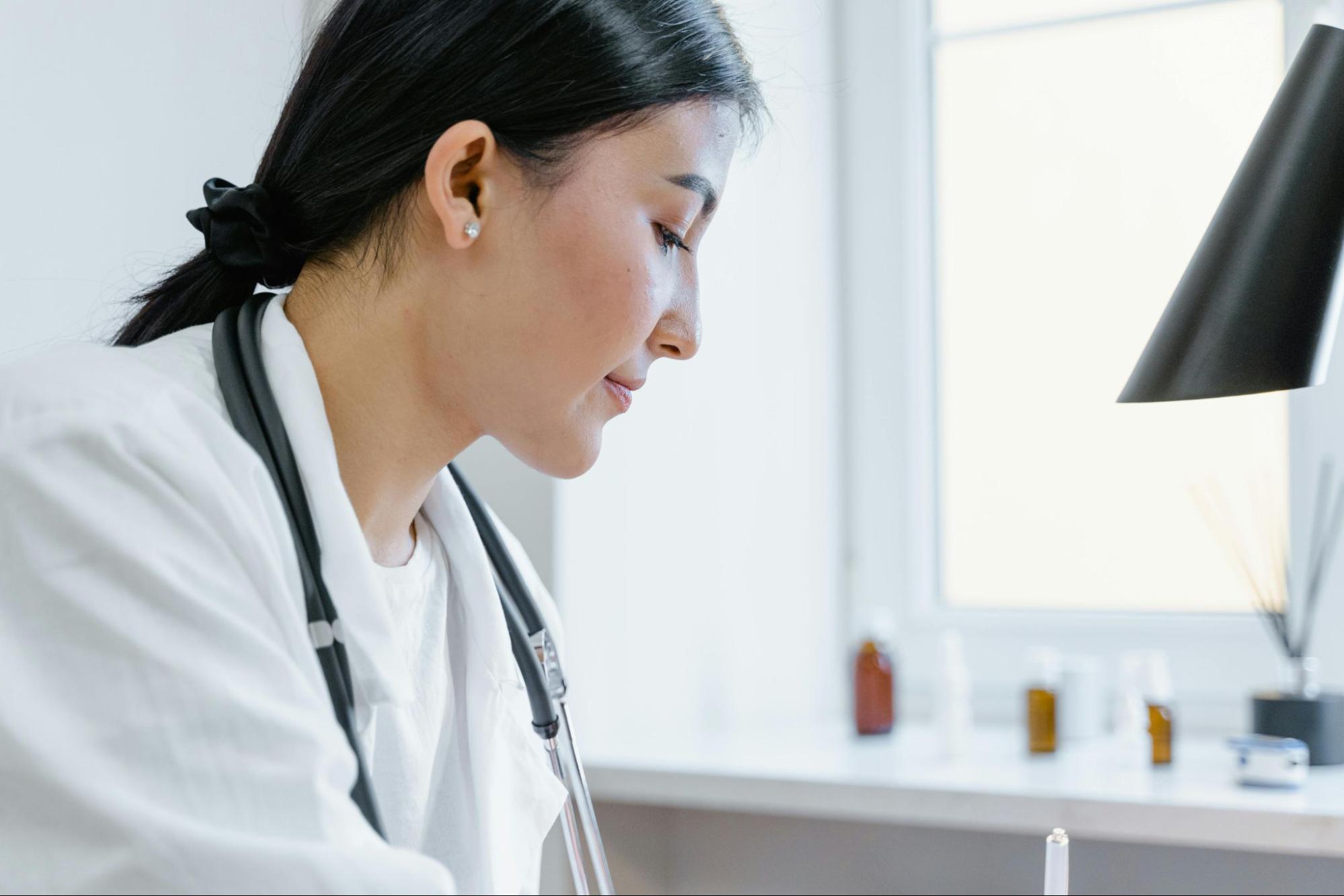 Female doctor working in office building