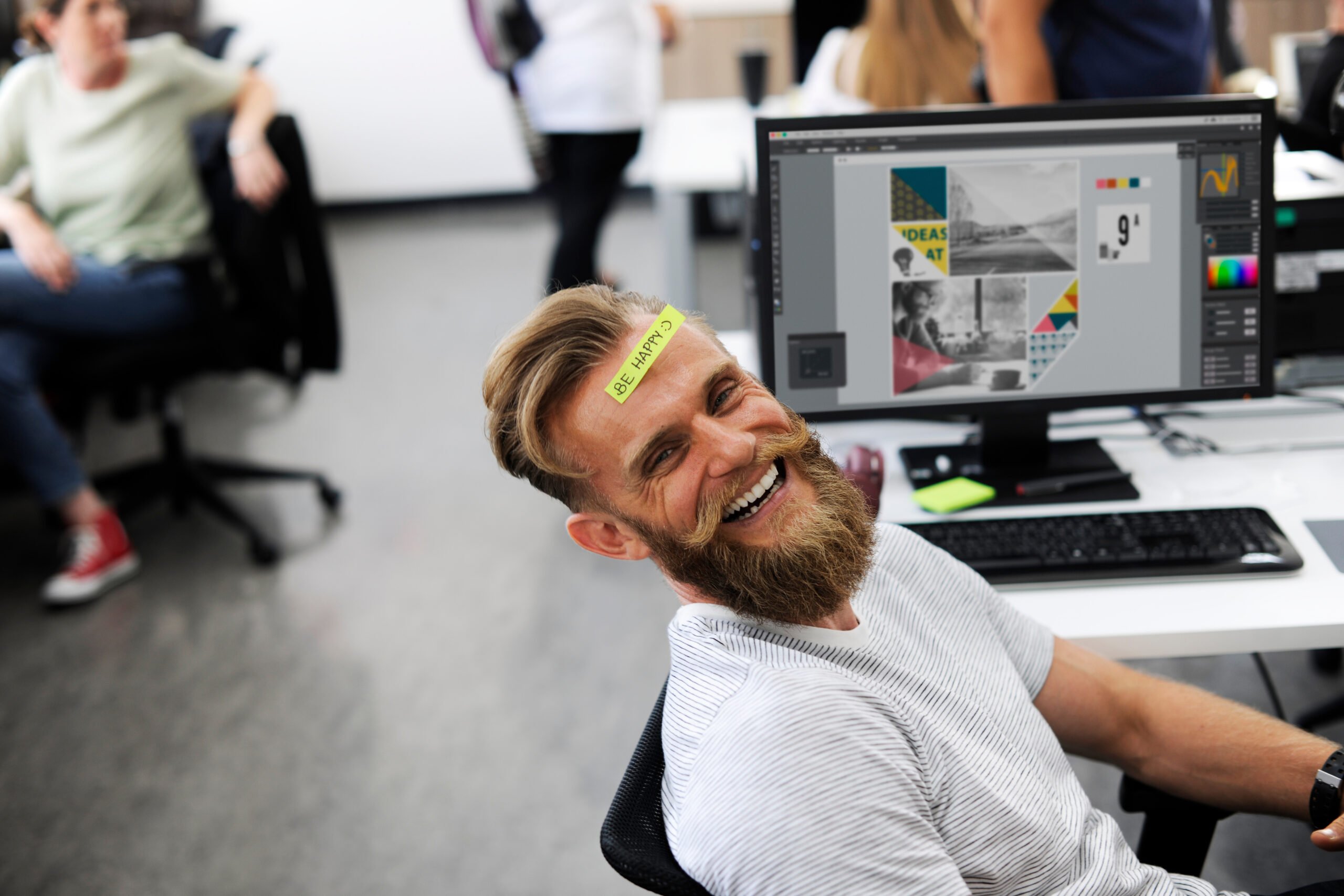 Funny employee appreciation note on a laughing office workers forehead