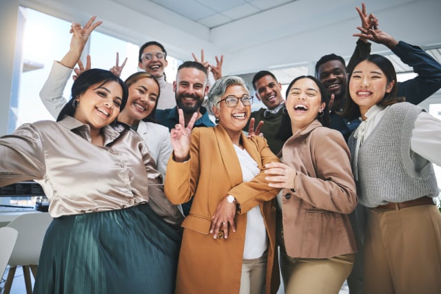 Group saying thank you to a mentor together in office