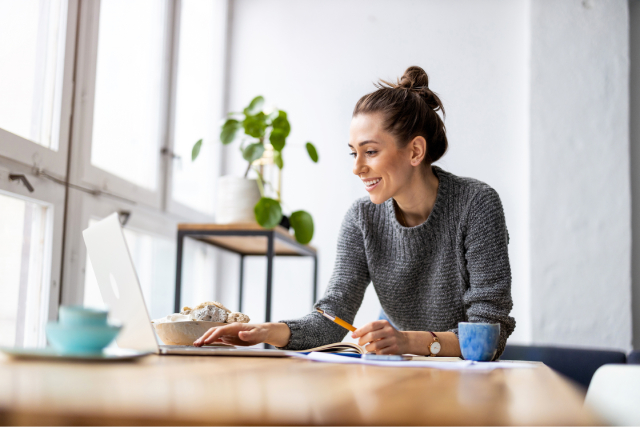 Person editing an online group card at computer