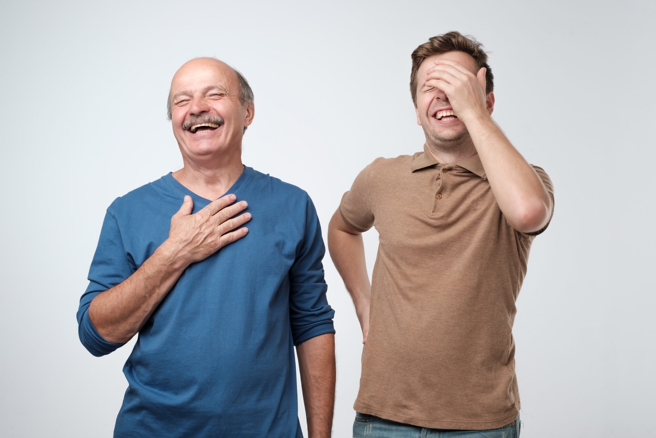 Father and son laughing together at funny Happy Father's Day messages