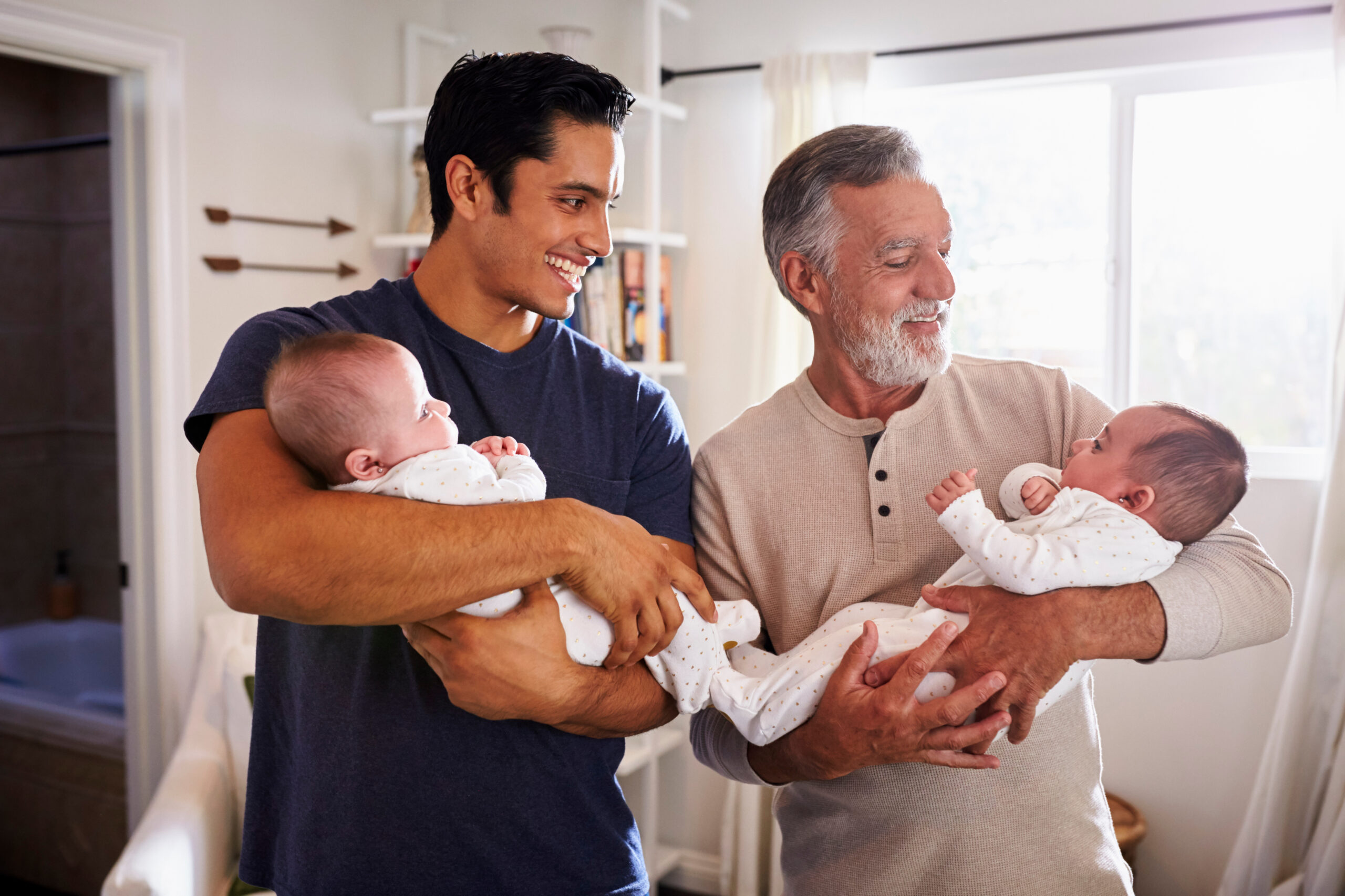 New dad and grandpa holding babies on Father's Day