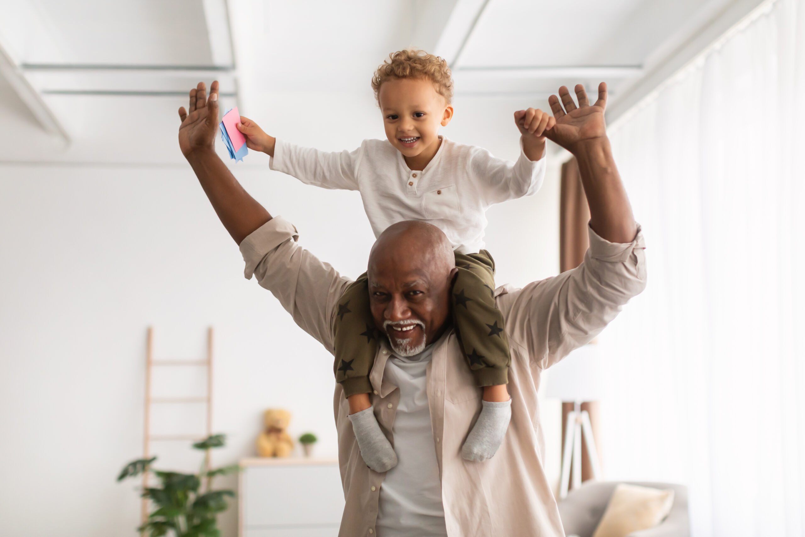 Retiree celebrating with grandchild in the office