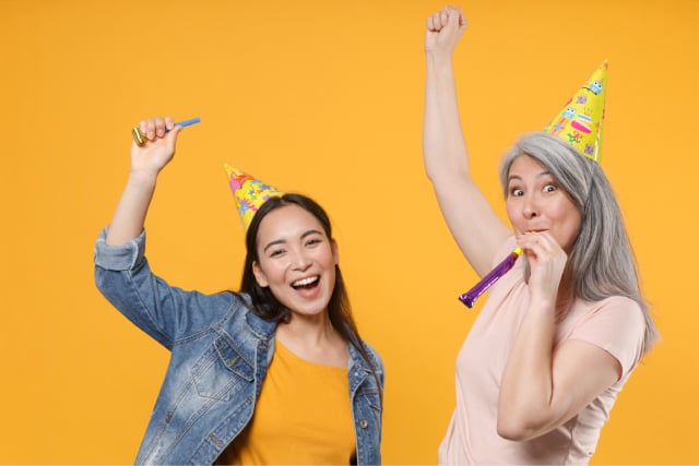 Mom celebrating with daughter after giving happy birthday mom messages