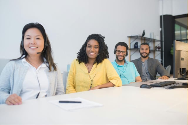 HR sitting around table discussing the difference between employee engagement and job satisfaction