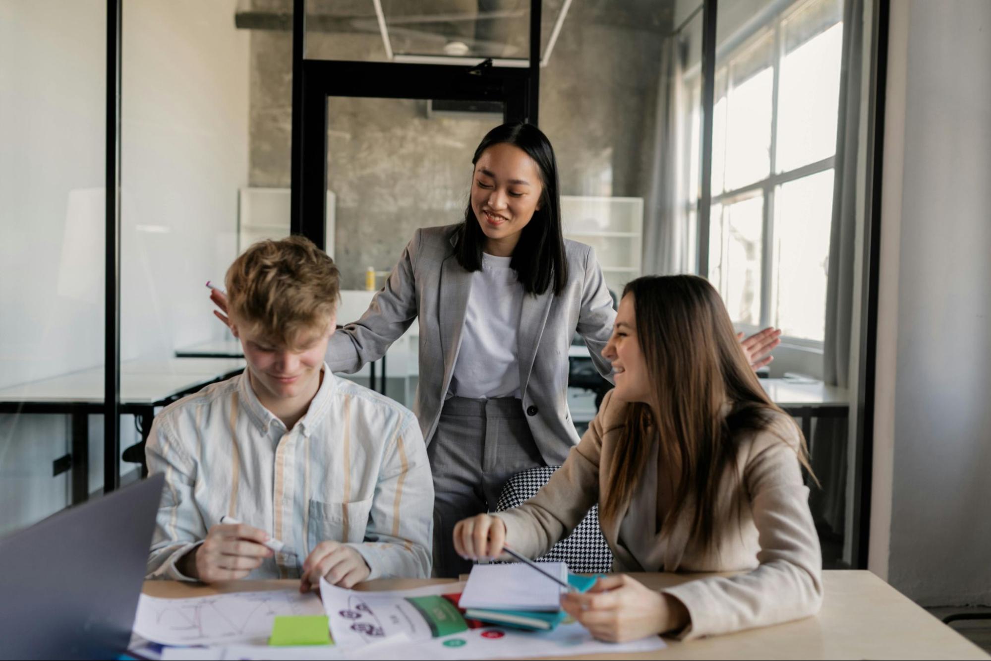 Manager engaging with two employees