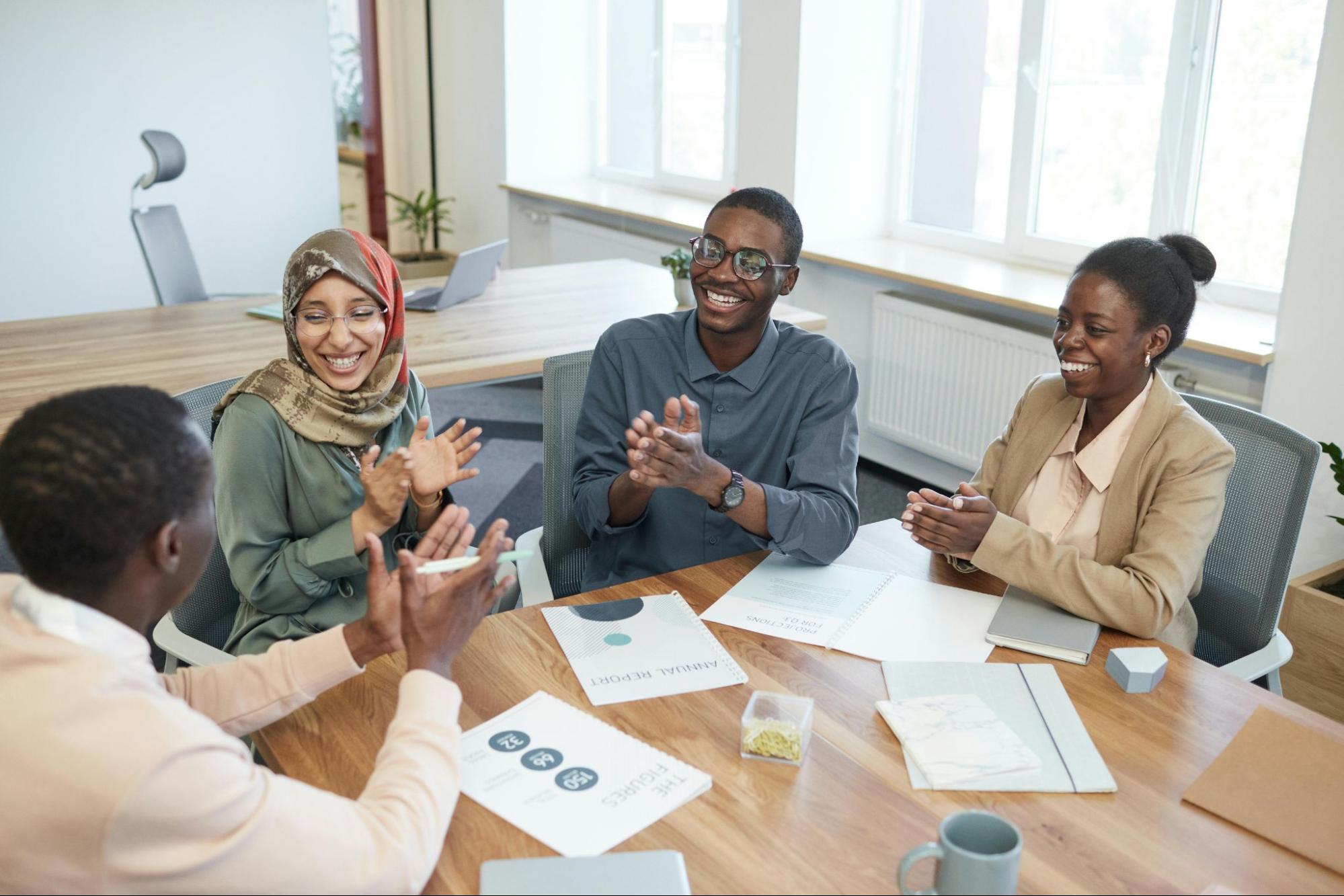 Employees engaging with boss in the workplace