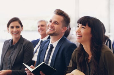 Engaged employees listen to a presentation