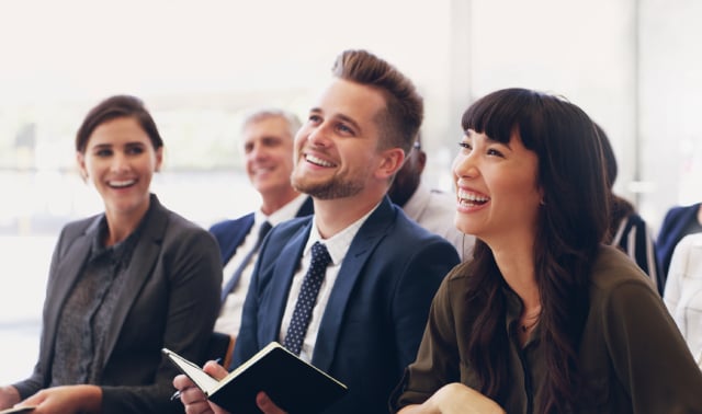 Engaged employees listen to a presentation