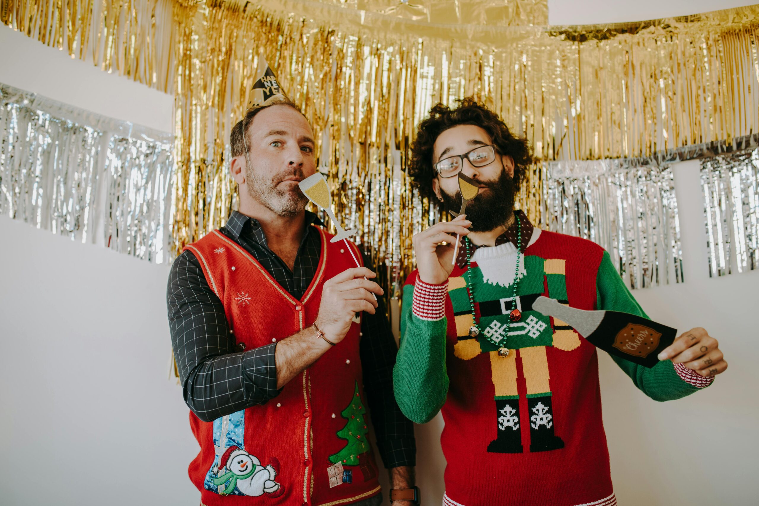 Coworkers at a holiday party photo booth